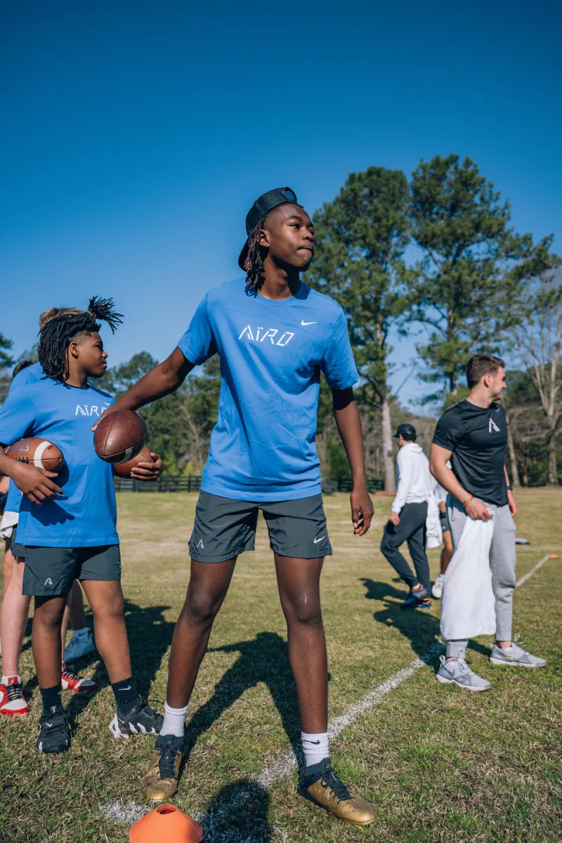 Athletes with footballs