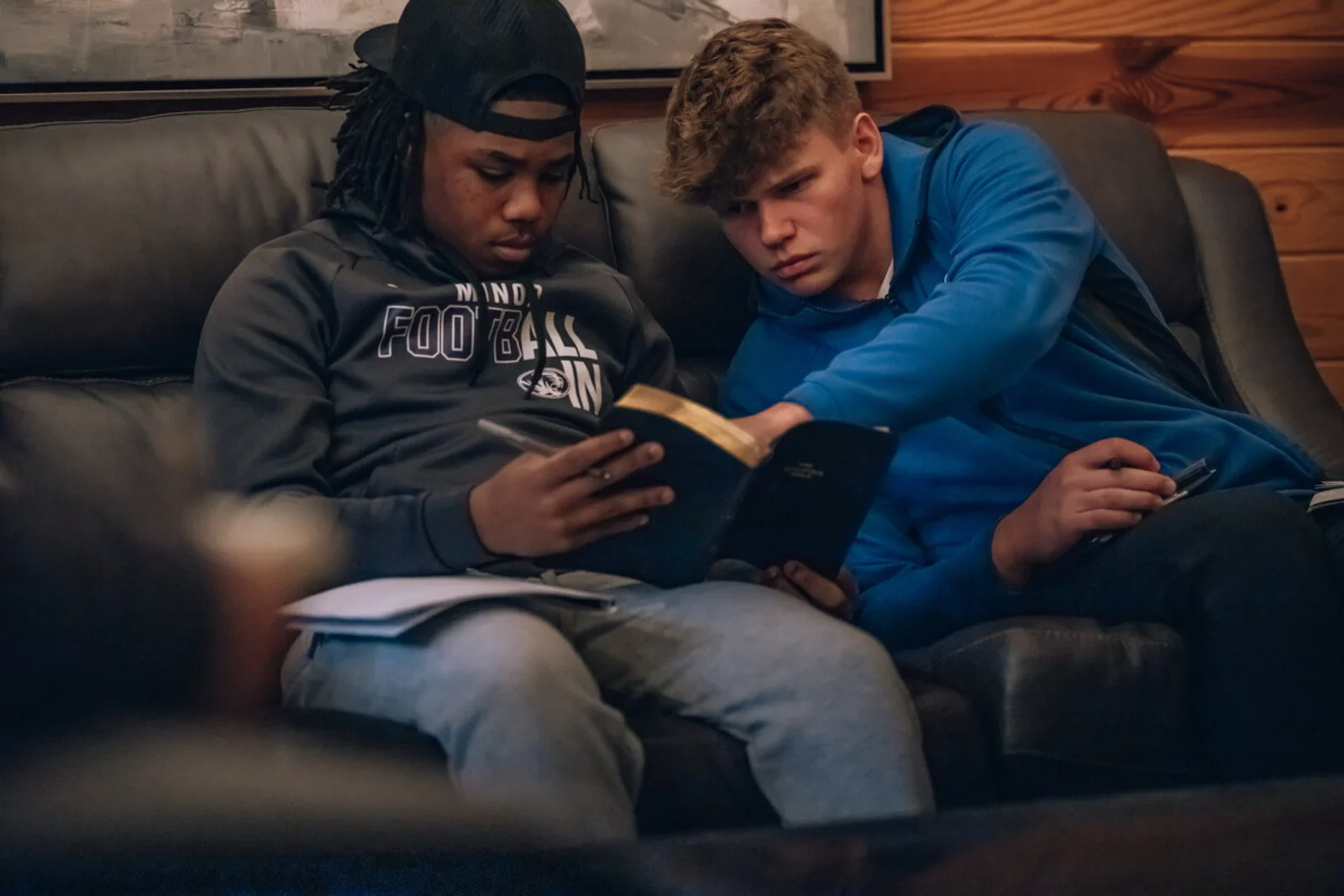 Athletes studying the Bible together
